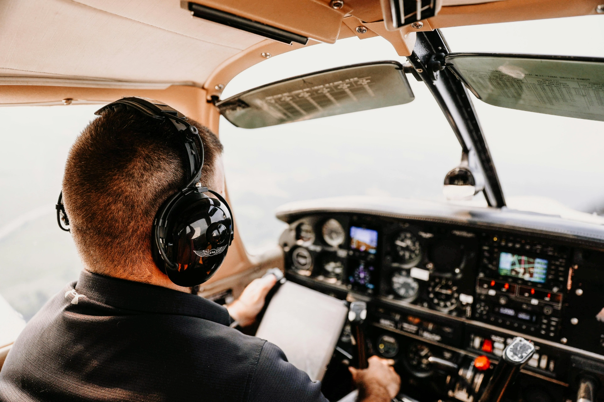 - iterates Pilot in the cockpit of an aircraft checking the navigation instruments.